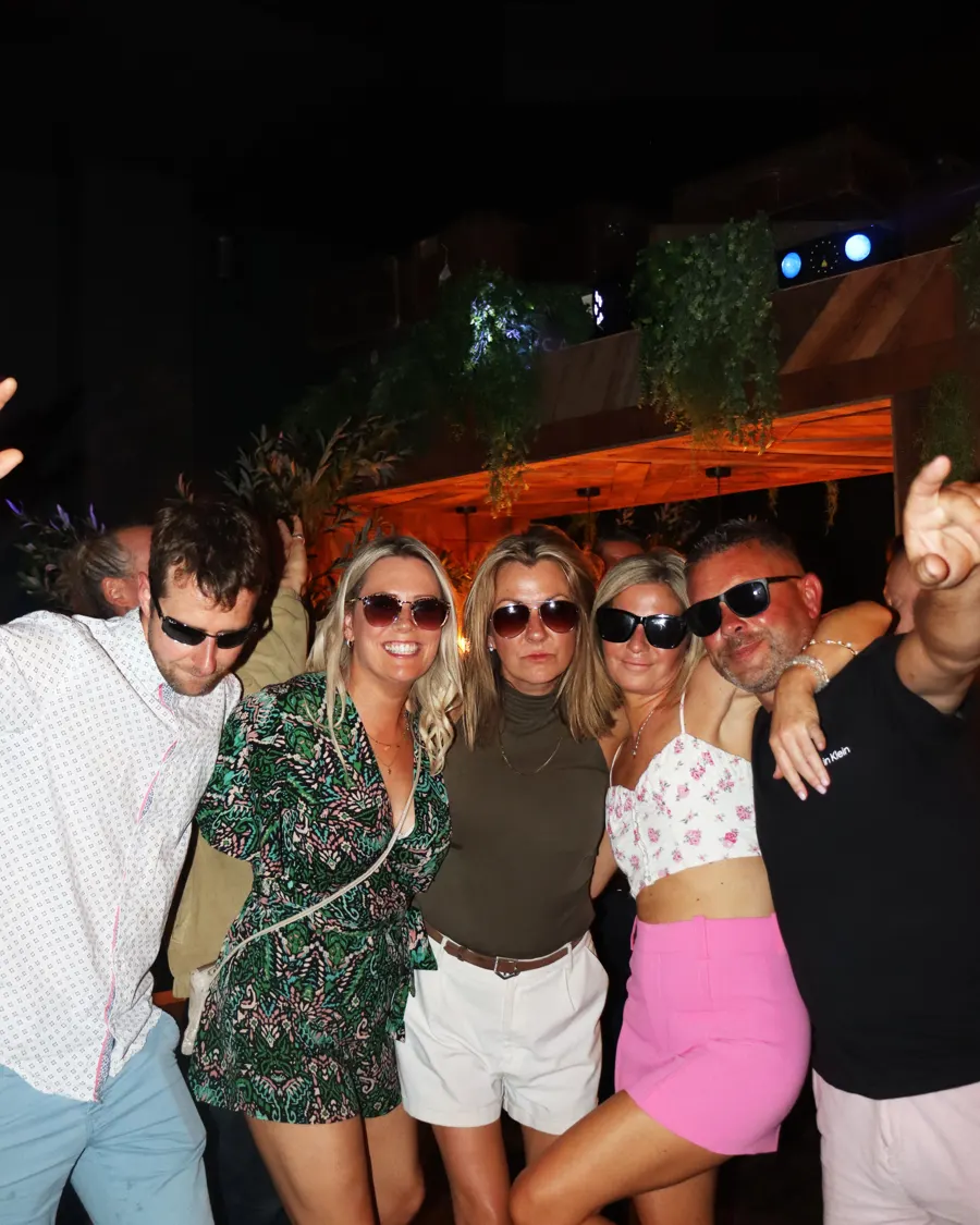 Friends dancing together at a Soirée night